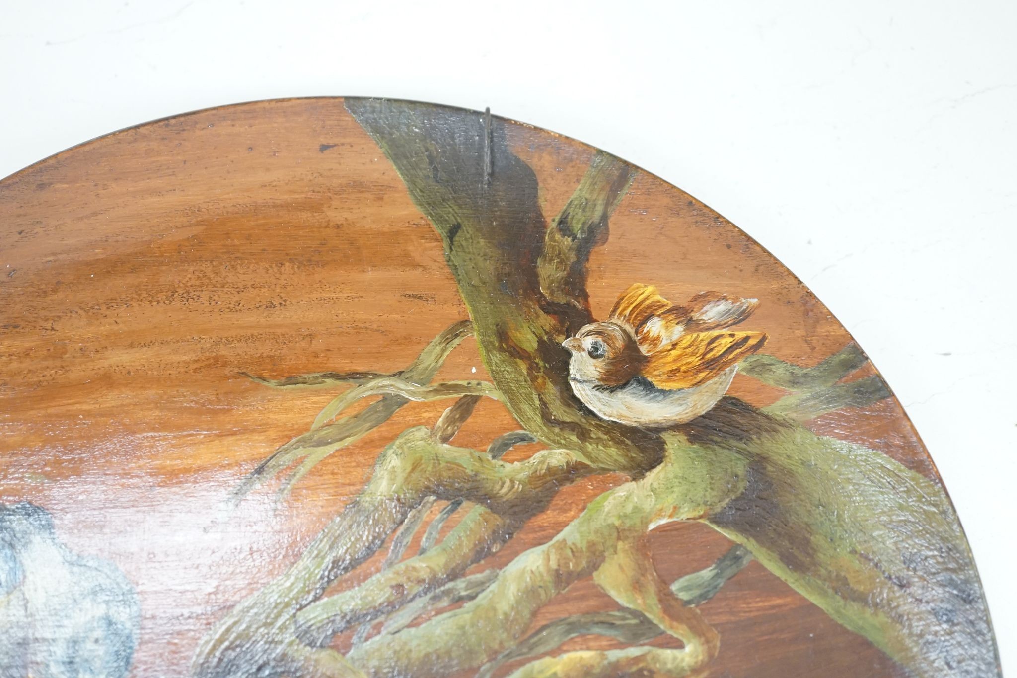 A Continental terracotta wall plaque and a Poutney & Co plaque (2) 39cm